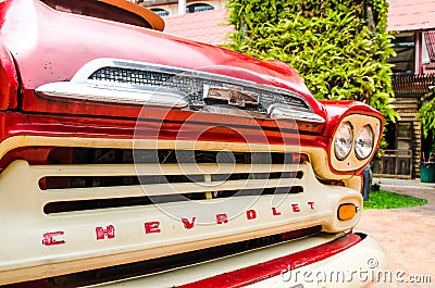 Close up front view of Red classic Chevrolet apache pickup truck for park decoration at Ban Bang Khen. Editorial Stock Photo